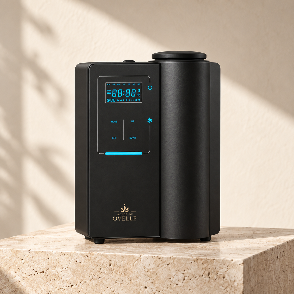 Ovelle Atelier diffuser in matte black on warm travertine