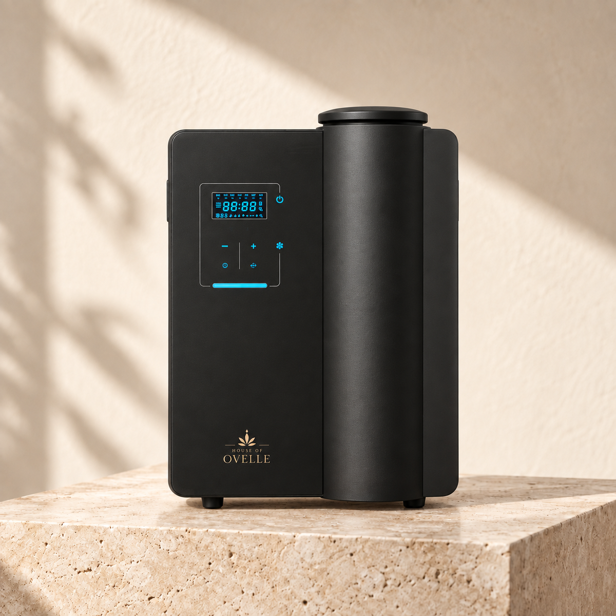 Ovelle Estate diffuser in matte black on warm travertine