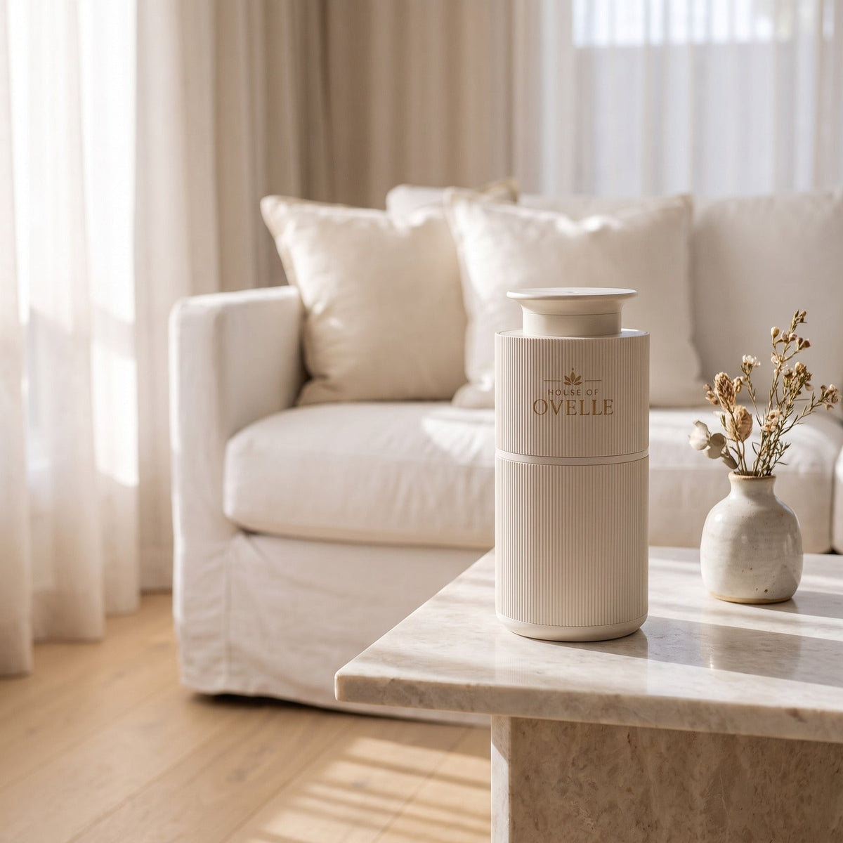 Ovelle Nomad in matte white on a marble side table in a bright living room