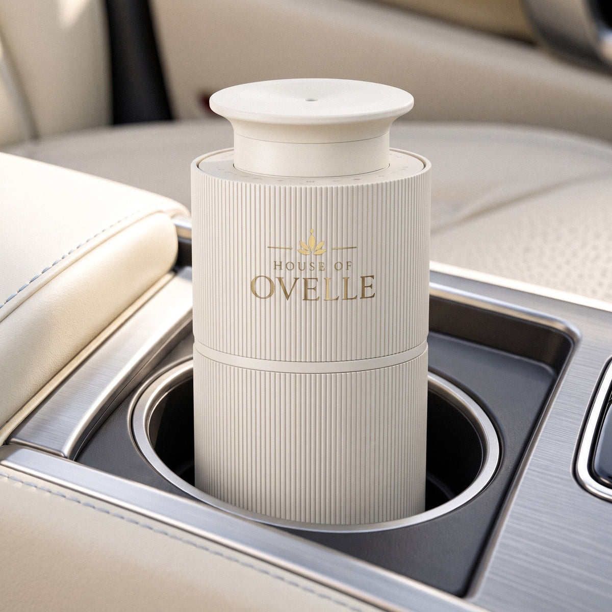 Ovelle Nomad in matte white in the cup holder of a car with a cream leather interior